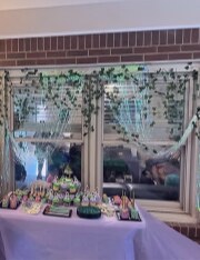 Treat table with ivy greenery framing the window