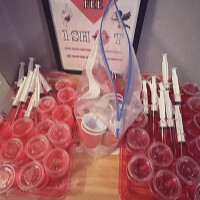 Red jello shots in cups for a party