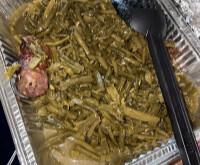 Green beans with smoked turkey and serving tongs