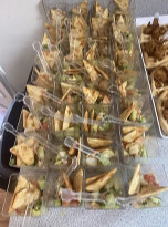 Individual cups of sandwiches and snacks