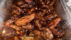 Pan of glazed barbecue chicken wings